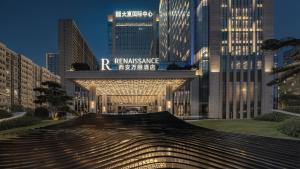 a large building with a bridge in the city at Renaissance Xi'an Hotel in Xi'an +111 photos