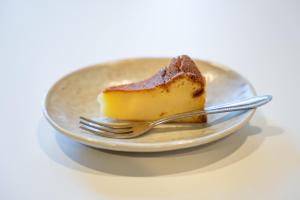 a piece of cake on a plate with a fork at HOTEL PG -2- - Vacation STAY 38330v in Onomichi +1 photo