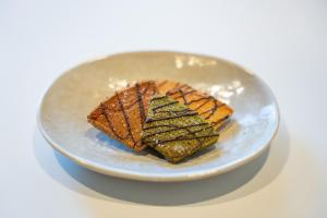 a white plate with two pieces of food on it at HOTEL PG -2- - Vacation STAY 38330v in Onomichi