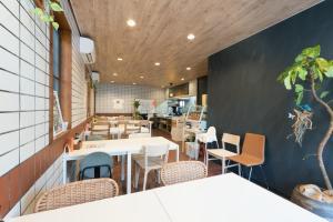 a dining room with tables and chairs in a restaurant at HOTEL PG -2- - Vacation STAY 38335v in Onomichi