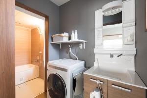 a washing machine in a bathroom with a sink at HOTEL PG -2- - Vacation STAY 38335v in Onomichi