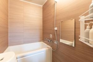 a bathroom with a tub and a toilet and a sink at HOTEL PG -2- - Vacation STAY 38335v in Onomichi