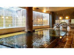 a large pool of water in a large room at Hotel Symphony - Vacation STAY 67006v in Sagae