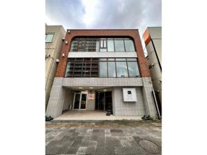 a large building with a lot of windows at Monarch Hotel - Vacation STAY 43004v in Otaru