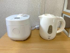 a coffee maker sitting on a table next to a mixer at Sakae - Vacation STAY 41407v in Goto