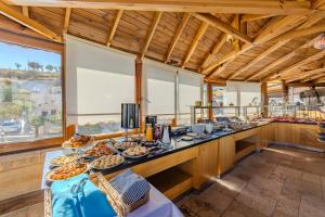 a buffet in a room with food on a table at Ascension Cave Suites - Special Class in Göreme +37 photos