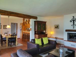 a living room with a couch and a table at Holiday Home Stellina del Sole by Interhome in Brissago