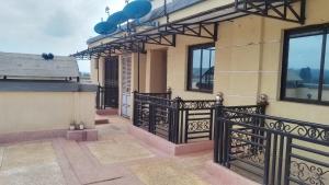 a balcony of a house with a black fence at Studio apartment in Ruka in Ruaka