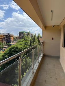 a balcony with a view of a city at Studio apartment in Ruka in Ruaka