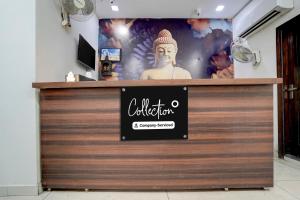 a store front with a sign on a wooden door at Super Collection O by OYO Patiala Road Crossway Zirakpur Formerly Lavish in Zirakpur