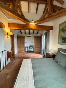 a large room with a bed and a couch at Cuq en Terrasses in Cuq-Toulza