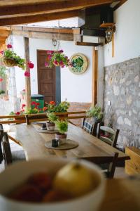 a dining room with a table with potted plants at Sunset House in Ohrid +50 photos