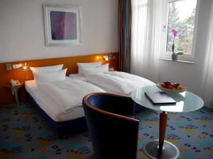 Postel nebo postele na pokoji v ubytování Business-Hotel Artes