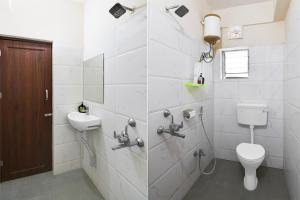 a bathroom with a toilet and a sink at Super Collection O Newtown Bus Stand Formerly The Executive Suites in New Town