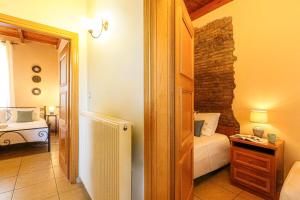 a small room with a bedroom with a bed at Villa Anthemida Chania in Ayiá +38 photos