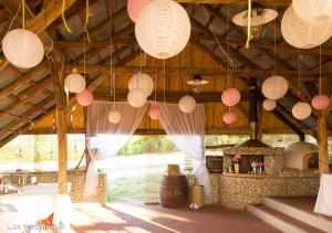 a room with paper lanterns hanging from the ceiling at Vinum Vivo winery in Nevidzany