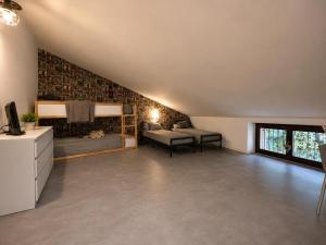 a room with two bunk beds in a attic at Da Mara Lago Di Como in Sormano