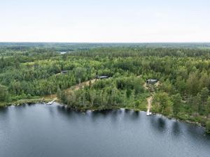 an island in the middle of a lake at Holiday Home Paradiset by Interhome in Holmsjö