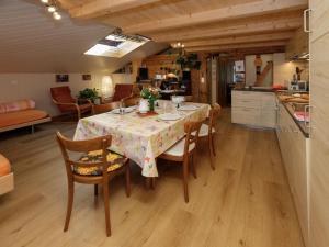 a kitchen and dining room with a table and chairs at Apartment Beim Thor Klein by Interhome in Brienzwiler