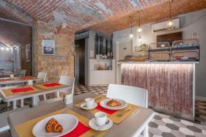 a kitchen and dining room with a table and chairs at Hotel Cosmos in Florence