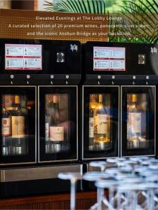 a bunch of bottles of wine in a display case at Shangri-La Chengdu in Chengdu