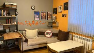 a living room with a couch and a table at The Kalavan Retreat Center in Chambarak