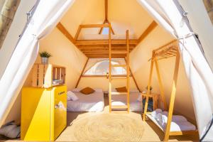 a room with two beds in a tent at Kampaoh Kikopark Playa in Oliva +68 photos