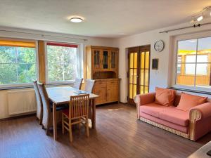 a living room with a table and a couch at Apartment Florence in Wettringen