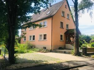 a house in the middle of a garden at Apartment Florence in Wettringen