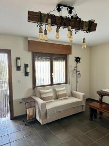 a living room with a couch and a table at Finca Viña Alberto in Cuéllar