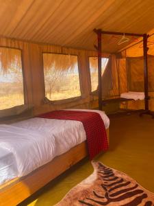 a bedroom with a bed in a tent at Samburu Tempo Camp in Archers Post