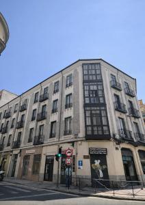 a large building on the corner of a street at Ele GuestHouse Plaza de España in Valladolid