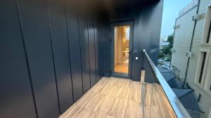 a hallway of a house with a wooden floor at Maskan Premium Hotel Tashkent in Aktepa-Chigatay +8 photos