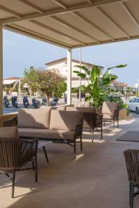 a group of tables and chairs on a patio at Vi Place in Lido di Camaiore