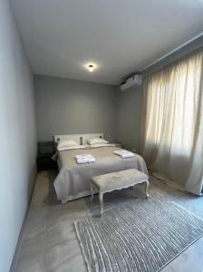 a bedroom with a large bed and a rug at Mughni home in Ashtarak +17 photos