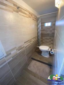 a bathroom with a toilet in a room at Magi - Zeus in Ponza