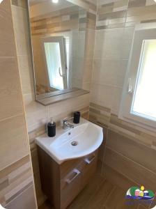 a bathroom with a sink and a mirror at Magi - Zeus in Ponza