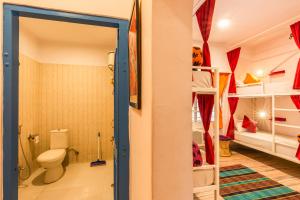 a bathroom with a toilet in a room at goSTOPS Jaipur, Civil Lines in Jaipur