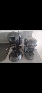 a coffee maker sitting on top of a stove at Le puny in La Motte-en-Champsaur