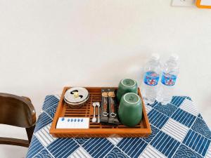 a tray of food and water bottles on a table at Lộc Phát Hotel Mộc Châu in Làng Môn