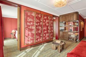 a living room with a red wall at Hotel España Ocean Drive - Newly Renovated in Barcelona