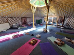 an overhead view of a yurt with yoga mats at Lélek-Tér in Siófok