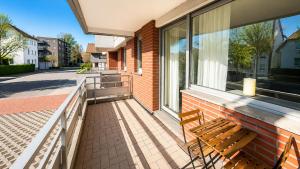 a bench on the balcony of a house at Pulheim Living 3 in Pulheim