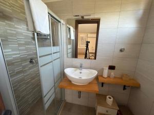 a bathroom with a sink and a mirror at Villa Anté B&B in Angri +47 photos