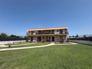 a large building with a large lawn in front of it at Villa Anté B&B in Angri