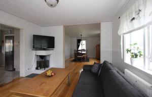 a living room with a couch and a table at Villa Oakfield in Fröseke