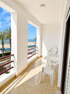 a balcony with a view of the beach at Apartamentos Carteia in Quarteira +216 photos