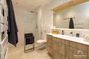 a bathroom with a toilet and a sink and a shower at La VILLA du Reims - Mon Gîte Facile in Colmar +51 photos