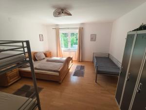 a bedroom with a bunk bed and a window at Apartment Camping Melk in Melk
