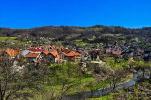 a group of houses on a hill in a town at Apartmani Resimic in Ivanjica